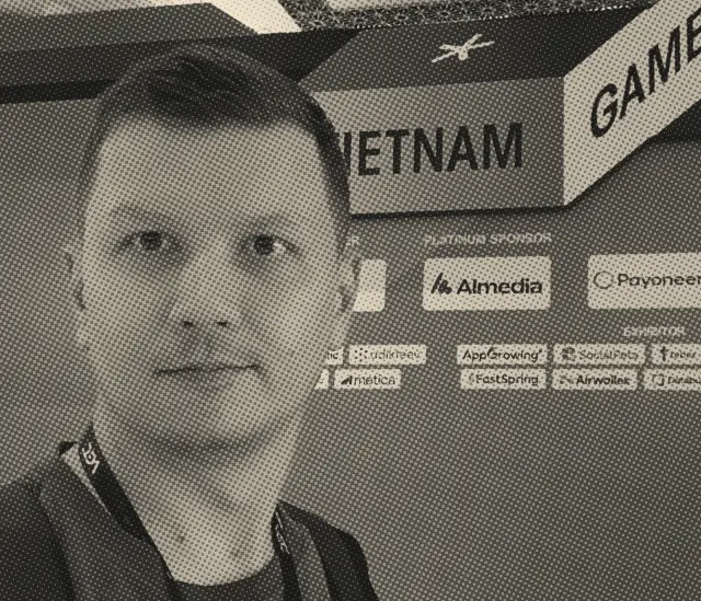 Ilia at the sponsor wall of a games conference